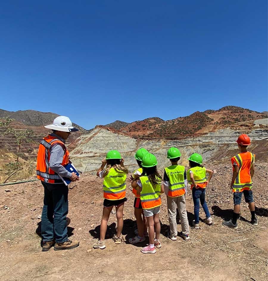 Fernando Alday, Manager-Resource Management and Environmental, leads Bisbee students on a tour of the discontinued operation which was closed in the 1970s.