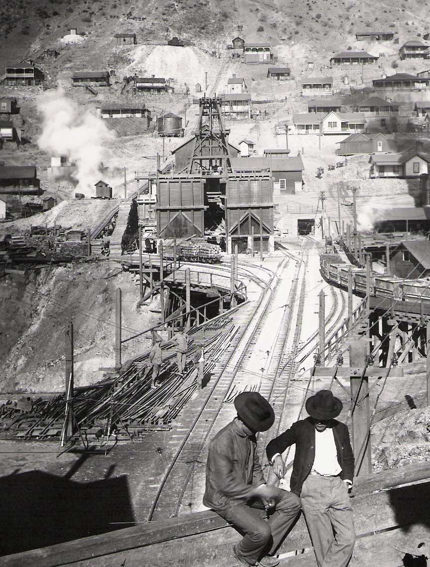 A pair of miners in front of the Joy shaft, Morenci, acquired by Phelps Dodge in 1921.