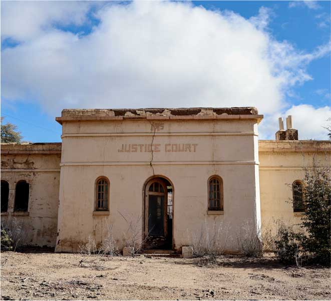Today, little remains of the old Tyrone townsite beyond ruins of the courthouse and church.