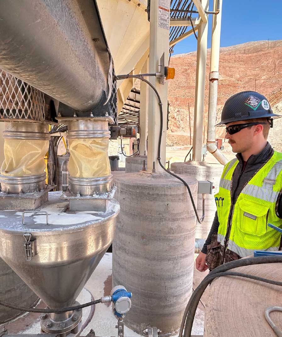 Trent Klocek checks the auger machine feeding additives into the raffinate stream at Morenci.