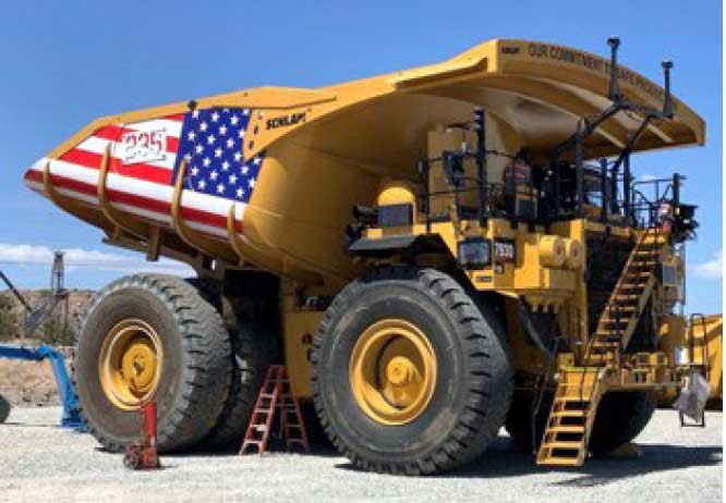Bagdad haul truck with an American flag-themed Schlam truck bed.