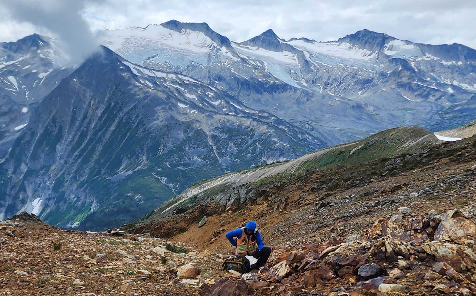 Ingemar Arellano, Chief Geologist, collects rock samples at the Joy project in Canada.