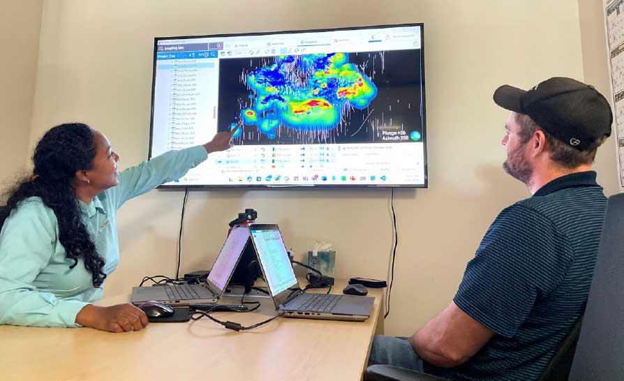 Rachel Rapprecht and Peder Skollingsberg review mineral distribution data at Morenci.